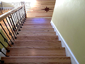 Custom wood StaircaseInstallation by District Flooring & Restoration 