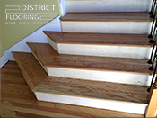 Custom wood StaircaseInstallation by District Flooring & Restoration 